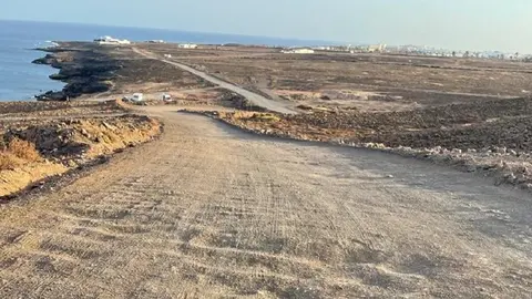 Estado de la carretera de acceso a Los Ancones.