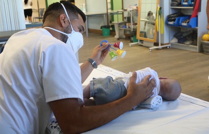 8sep baby with physiotherapist